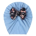 Detail of baby turban hat in light blue with a large floral print bow decoration - Blue