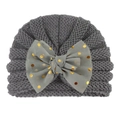 Detail of grey baby knitted turban hat featuring a large mesh bow with gold sequins - Gray