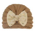 Detail of baby turban hat featuring a knitted design and oversized polka dot bow - Coffee