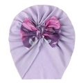 Detail of soft purple baby turban hat featuring a large floral print decorative bow - Light Purple