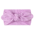 Detail of soft light purple nylon baby headband with a decorative large rabbit ear knot - Purple
