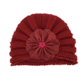 Detail of burgundy knit baby hat featuring a large fabric flower with pink bead center - One Size / Wine Red + Red