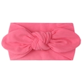 Detail of bright pink nylon baby headband featuring a soft knit fabric bow design - Rose Red