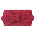 Detail of soft nylon baby headband with a dark red rabbit ear bow design - Burgundy