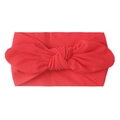 Detail view of bright red soft nylon baby headband with a large decorative bow - Red