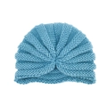 Detail of light blue knit turban hat for babies featuring center knot and ribbed texture - Blue