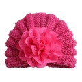 Close-up of rose pink baby knit hat featuring a large layered lace flower decoration - Adjustable / Rose Red