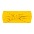 Elastic mustard yellow ribbed baby headband featuring a stylish central knotted design - Yellow
