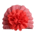 Close-up of pink knit baby turban hat with a large red fabric flower detail - Adjustable / Dusky Pink