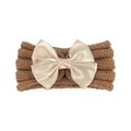 Close-up of brown ribbed knit baby headband with a large champagne satin bow detail - Coffee