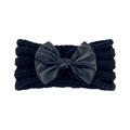 Detailed view of the black knitted baby headband with a large matching satin bow - Black