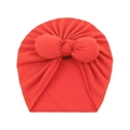 Detail of red baby turban hat with oversized bow made of soft knitted cotton fabric - One Size / Orange