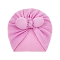 Detail of soft knit pink baby turban hat with a large decorative front bow - One Size / Pink