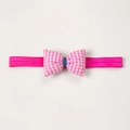 Detailed view of magenta elastic baby headband featuring a pink checkered bow accent - Rose Red