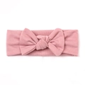 Soft light pink knitted baby headband with a large bow detail on white background - Dusky Pink