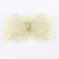 Soft cream nylon baby headband with a large glittery gold sequin mesh bow - Beige