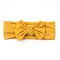 Soft knitted cotton baby headband in vibrant yellow with a large central bow accent - Yellow