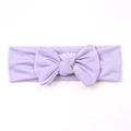 Soft knitted lavender baby headband featuring a large bow detail and ribbed texture - Purple