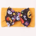 Halloween infant headband with orange waffle bow featuring pumpkins and skulls - Khaki/Earth Yellow