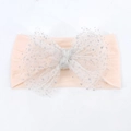 Soft nylon baby headband in apricot pink with a large white glittery mesh bow - Flesh Pink
