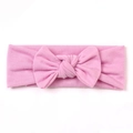 Soft light pink baby headband featuring a handmade fabric bow design for infants - Pink