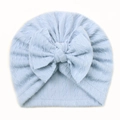 Infant cable knit turban hat in light blue with a large decorative front bow - Blue