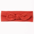 Bandeau élastique pour bébé avec un nœud rouge vif en oreilles de lapin sur blanc - Orange