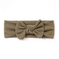 Soft knitted infant headband in dark olive green featuring a large textured bow knot - Dark Green