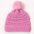 Pink knit baby beanie with fluffy faux fur pompom and ribbed texture for winter - Pink
