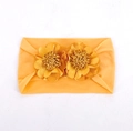 Elastic baby headband with two bright orange fabric flowers in center - Earthy Yellow