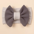 Elastic baby headband with a two-tone grey waffle texture bow and soft nylon fabric band - Gray