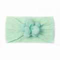 Détail du bandeau bébé vert menthe avec texture en maille douce et grande fleur décorative - Vert menthe