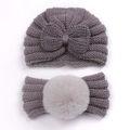 Detailed close-up of 2pcs baby knit set featuring dark grey bow hat and light grey pompom headband - Gray