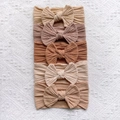 Detail of 5-piece cable knit baby headbands with bows in earthy neutral tones - Beige-Coffee-Dark Coffee-Brown-Light Coffee