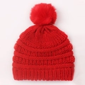 Red knit baby winter hat featuring a faux fur pom-pom and thick ribbed texture - Red