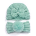Detail of mint green baby knitted beanie and headband set with a large bow and soft pompom - Mint Green