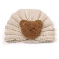 Cute off-white knitted baby hat with brown teddy bear patch for autumn and winter warmth - Beige