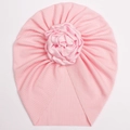 Pink ribbed baby turban hat featuring a large silk rose for infants and toddlers - Pink