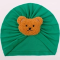 Soft emerald green knitted baby turban cap featuring a cute plush brown bear decoration - Green