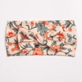 Detail of soft ribbed knit baby headband with floral print and a decorative bow tie - Off-White with Vintage Orange Floral Style (D)