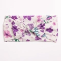 Detailed view of floral ribbed baby headband with bow and soft stretch fabric - White with Purple Floral and Polka Dots (E)