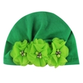 Detail of green baby turban hat featuring three tulle flowers with pearls and rhinestones - Green
