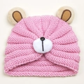 Close-up of pink knit bear hat for babies featuring thick yarn texture and cute 3D ears - Pink