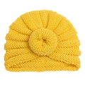 Bright yellow knitted baby turban hat with donut knot decoration on white background - Yellow