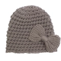 Detailed macro view of dark grey knitted baby hat with a large decorative bow - Gray