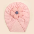 Close-up of pink baby turban hat featuring eyelet texture and a striped 3D flower detail - Pink