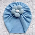 Detail of baby turban hat showing light blue waffle texture and 3D fabric flower - Blue