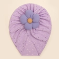 Detailed view of lavender baby turban featuring hollow knit texture and 3D floral accent - Purple