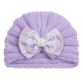 Detail of purple infant knit hat featuring large satin bow with lace and pearl accents - Purple
