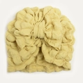 Close-up of bright yellow seersucker baby turban hat featuring a large decorative bow - Beige